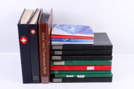 A collection of mint and used Switzerland stamps and covers in 11 albums.