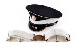 A Coldstream Guard cap with badge and ceremonial white leather belt.