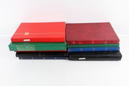 A collection of worldwide stamps in albums and loose in two boxes.