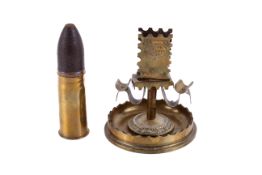 A piece of Trench Art and a shell.