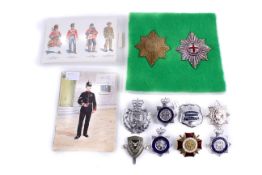 Two Coldstream Guard NCO pagri badges and some police badges.