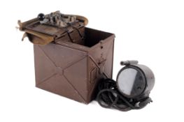 A WWII daylight signalling lamp and morse code box.