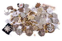 A collection of military badges and buttons.