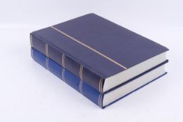 A collection of mint and used Spanish stamps in two albums.