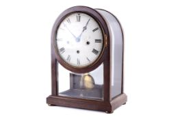 A Mahogany German four-glass arch top mantel clock.