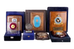 Seven military interest plaques, mostly boxed.