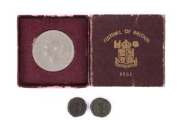 Two bronze Roman coins and a 1951 crown in box.