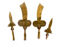 Four brass Trench Art finials.