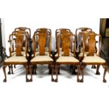 A set of twelve walnut dining chairs.