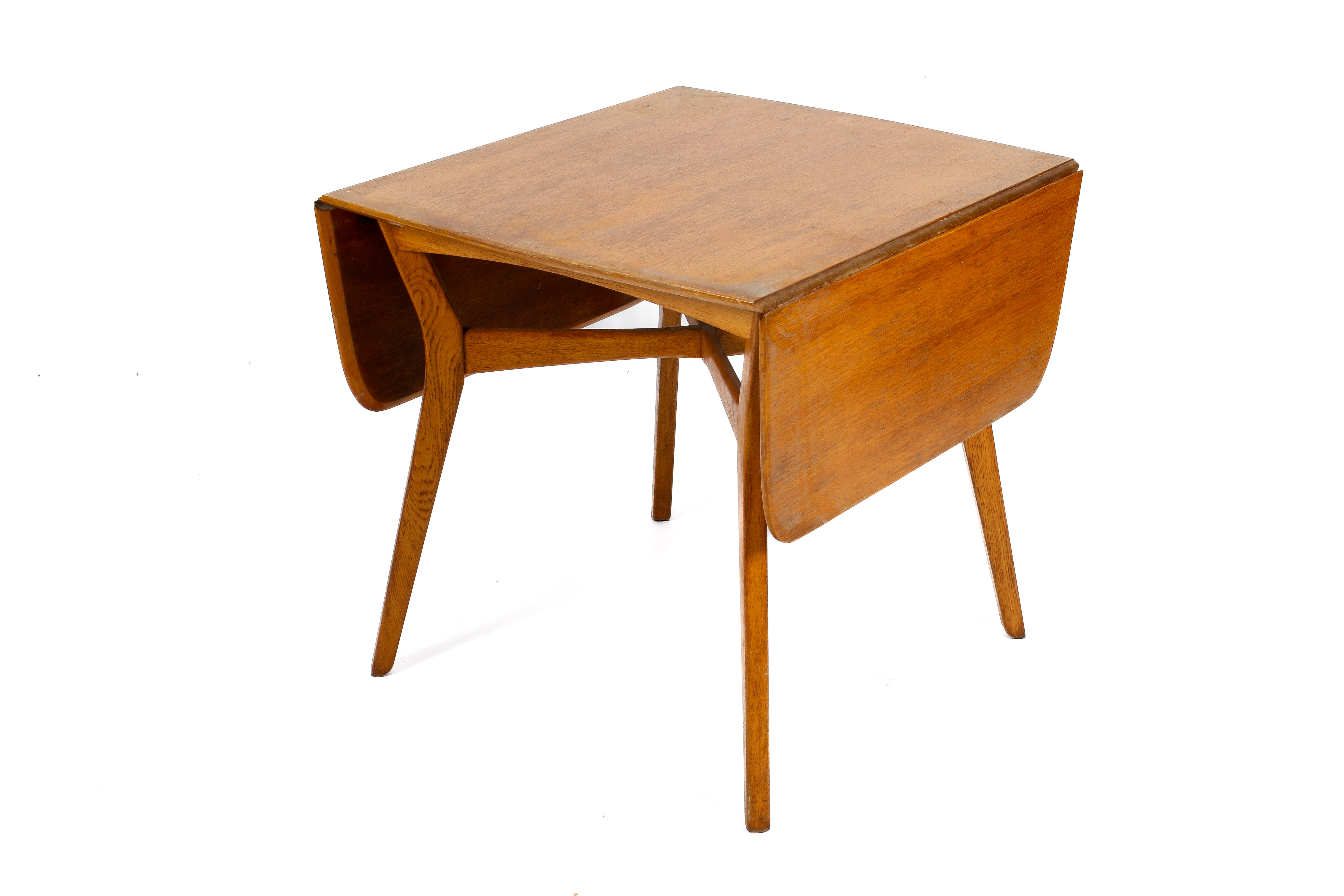 A mid-century G-Plan oak drop leaf table and four chairs by E Gomme. H75cm x W80cm x D138cm (open).