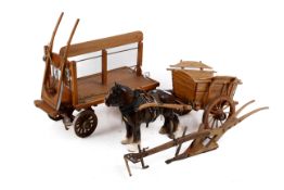 A Beswick shire horse with two wooden carts. The carts holding various cargo, horse H21.