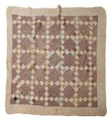 A vintage patchwork quilt bed spread.