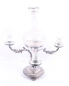 A silver plated epergne centrepiece with a glass decanter.