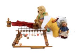 A collection of assorted vintage toys. Including a Steiff hedgehog, a golden mohair teddy bear, etc.
