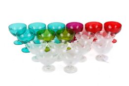 Seventeen assorted pressed glass dishes.