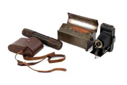 A Victorian telescope, vintage Kodak camera and a desk ink stand.