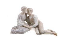 A Bing & Grondahl (Denmark) ceramic figure group. Modelled as a seated man and woman, No 1680, H15.
