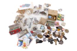 A collection of enamel badges and medals.