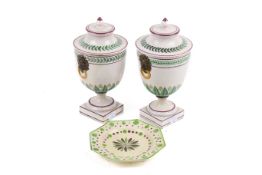 A pair of Staffordshire pottery urns and covers and a creamware plate. Max.