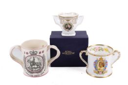 Three twin handled commemorative mugs.