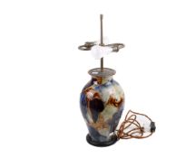 A 20th century ceramic table lamp base. Of baluster form, with mixed glaze finish.