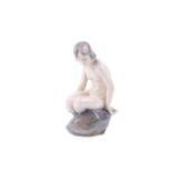 Royal Copenhagen porcelain figure 4029 'Girl on a Rock'. H14.