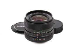 A Fujica 24mm f2.8 EBC Fujinon SW M42 lens. With front and rear caps. Good optics and body.