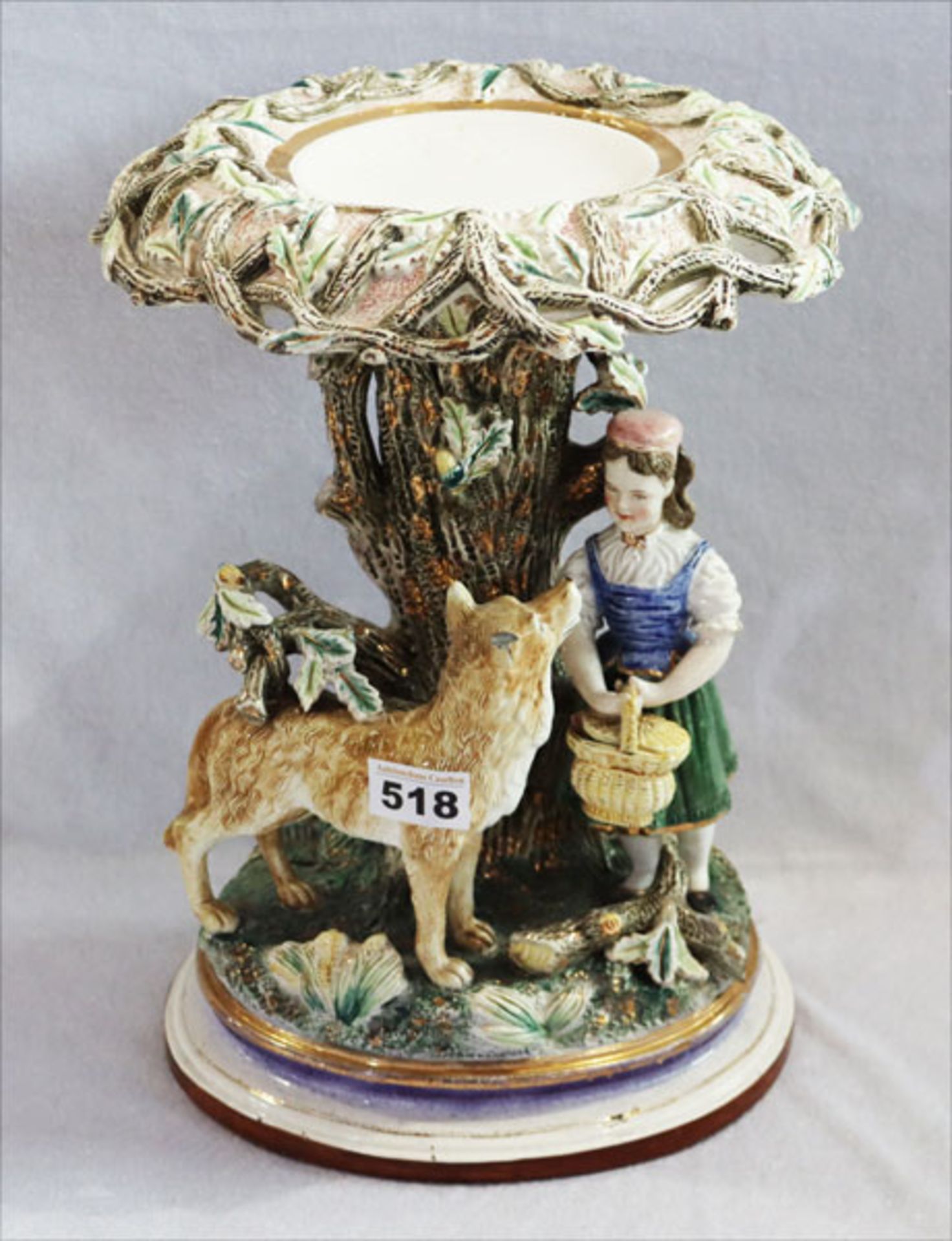 Porzellan Objekt 'Rotkäppchen mit Wolf', farbig glasiert, beschädigt und bestossen, H 35,5 cm, D