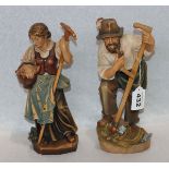 2 Holzfiguren 'Bauernpaar', farbig gefaßt, H 28/29 cm, teils berieben