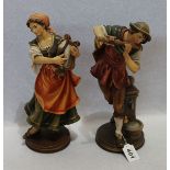 2 Holzfiguren 'Musizierendes Paar', farbig gefaßt, H 35 cm