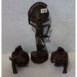 2 asiatische Holzfiguren 'Männer auf Wasserbüffel', mit Glasaugen, H 12 cm, L 22 cm, und
