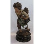 Tonfigur 'Junge mit Stifel und Tasche', bemalt, auf Sockel, teils bestossen, H 41 cm, Altersspuren