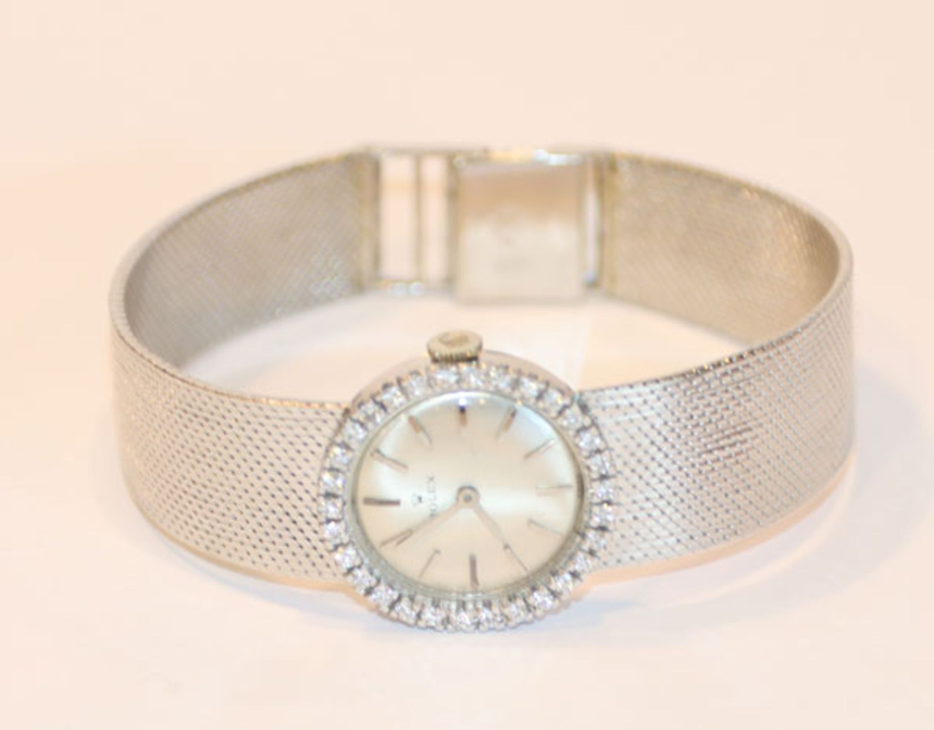 Rolex Damen-Armbanduhr, 18 k Weißgold mit Diamantkranz, Gewicht ohne Werk 43 gr., intakt, L 17 cm