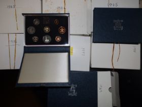 Seven cased GB Proof coinage sets, 1983-1989.