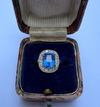A 3.03 carat natural Sri-Lankan sapphire & diamond cluster ring, the rectangular cushion cut