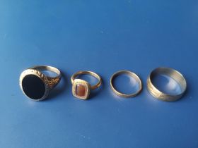 An 18ct wedding ring, a 9ct wedding ring and two others. (4)