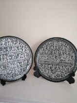 A pair of Egyptian 'Grand Tour' silver on copper damascened circular plaques decorated numerous