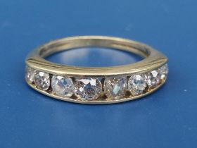 An 18ct gold half eternity ring set with eight graduated old cut diamonds. Finger size L.