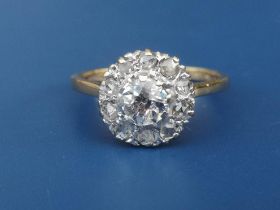 An old cut diamond cluster ring, the central stone weighing approximately 0.50 carat in 18ct & Plat.