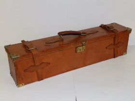 A leather gun case, 30.25" across.