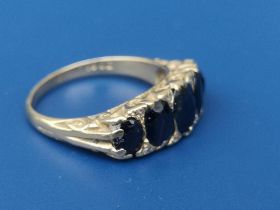 A five stone graduated sapphire ring on 18ct shank. Finger size K.