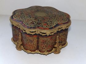 A late 19thC French red boulle jewellery casket, the lock engraved 'Bassy a Pau', 7" across.