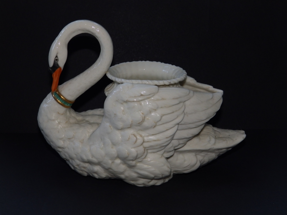 A Royal Worcester white glazed swan centrepiece with turquoise collar, impressed marks, 10" across -