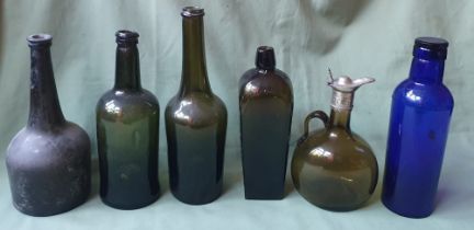A collection of antique glass bottles, the tallest 11".