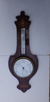 An Edwardian marquetry inlaid mahogany barometer of shield shape - W. Crambrook, Southampton, 34"