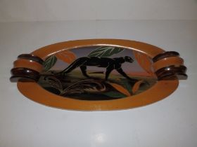 An Art Deco wooden handled glass tray with panther decoration to centre - 'Dope', 26" across.