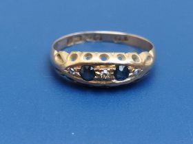 A small five stone sapphire & diamond set 18ct gold ring - Birmingham marks, 1915. Finger size N.