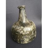 An antique onion shaped glass wine bottle, 6.4" high - crack to side.