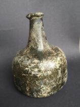 An antique onion shaped glass wine bottle, 6.4" high - crack to side.