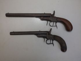 Two percussion lock pistols with octagonal barrels, one with chequered grip - de-activated, the